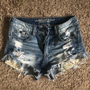 Sequin pocket distressed jean shorts